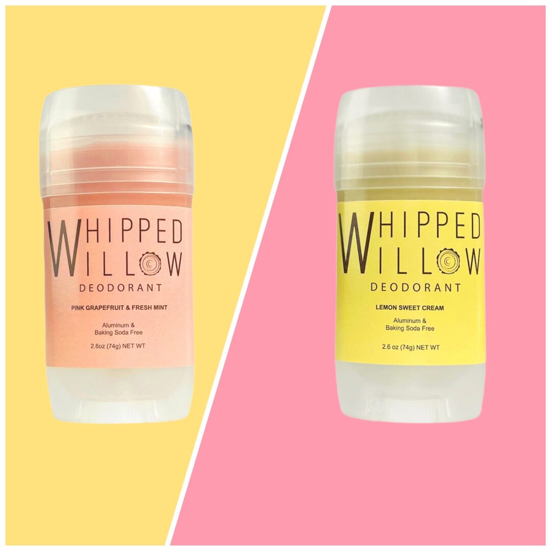 Two different colored deodorant sticks on a pink and yellow background.